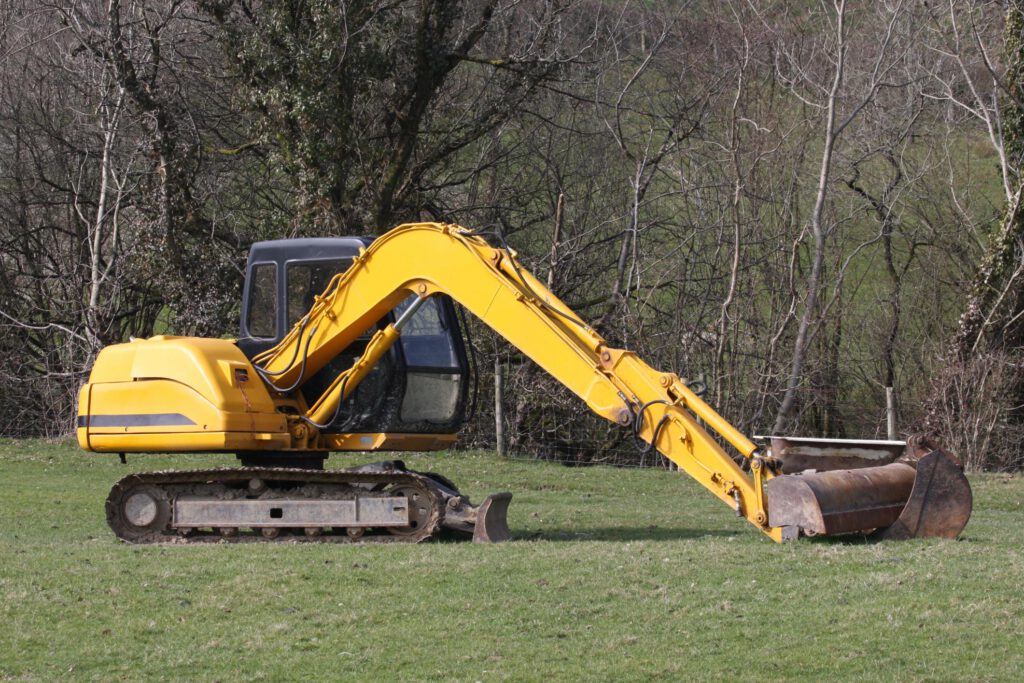 excavator in the grass